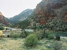 A lime green, yellow, and red landscape of Lodore Canyon