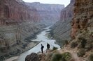 Two men enjoying the view from just below the Nankoweep Graineries in Grand Canyon