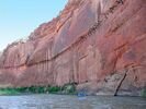 The remains of a wooden flume from the 1800's attached high on a red cliff face