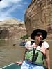 A woman sitting in a whitewater raft