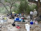 A river rafting group camped on the edge of a beach