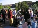 A large group of people lining up to eat a buffet dinner
