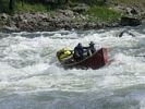 TWo men in a red dory going sideways in Big Mallard rapid, Main Salmon River