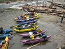 A row of colorful catarafts parked at Lake Creek, Middle Fork Salmon, Idaho