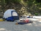 Two persons taking naps on a rafting trip