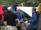 Three men enjoying a conversation on a rafting trip