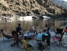 A group lounging on the beach at Pullman Mine Camp, Lower Salmon River, Idaho