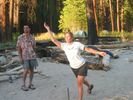 Couple playing horse shoes on a beach