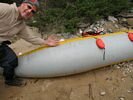 The repair to a 32-inch rip in a cataraft tube