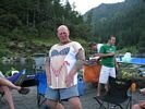 Same man wearing a tee shirt with a woman in a bikini on it
