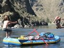 Boys flipping off a raft on the Lower Salmon, Idaho